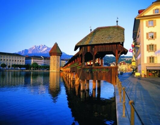 A view of buildings surrounding a lake